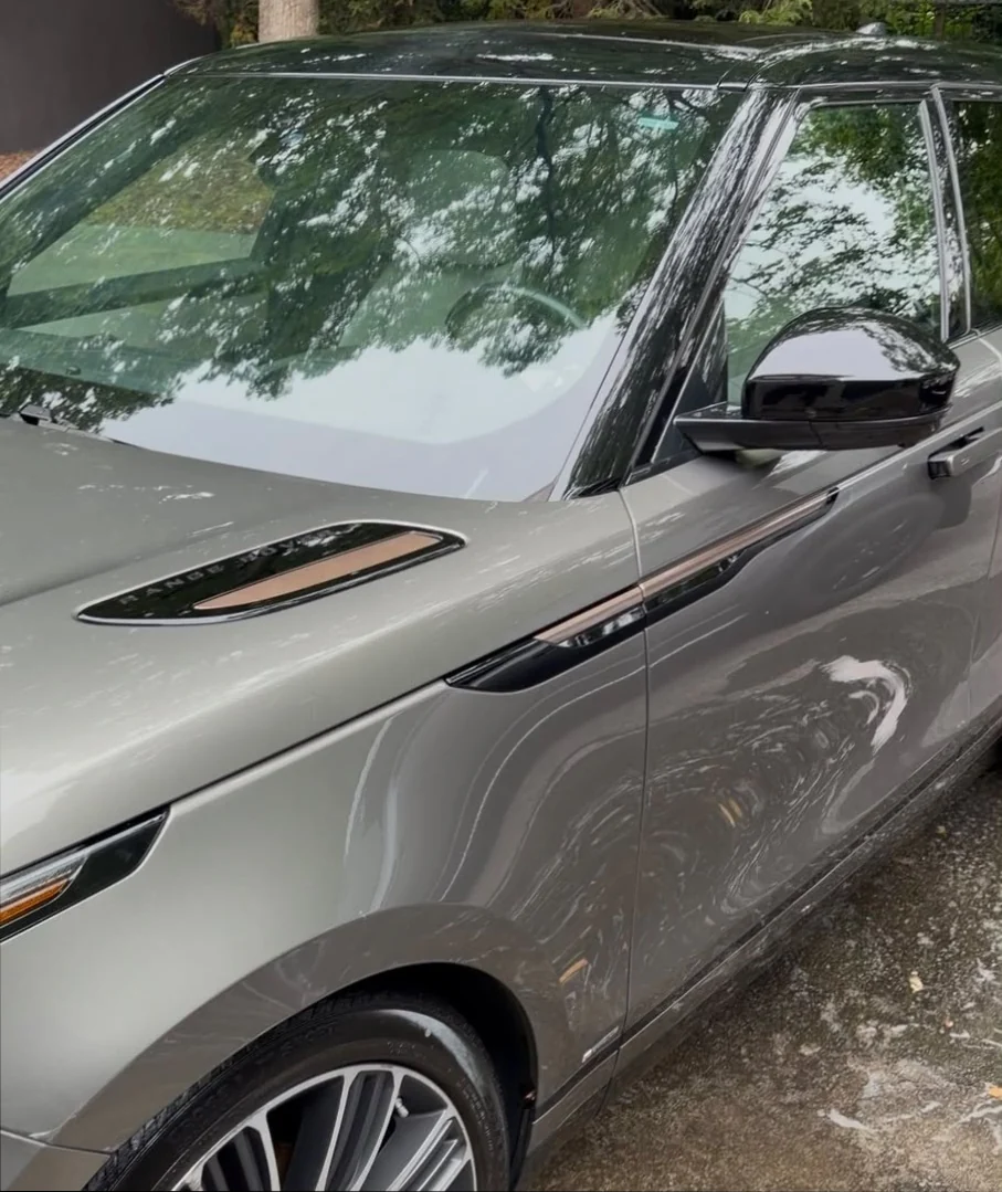 Grey Range Rover Velar after a Royal Auto Spa wash, with clean glass and a glossy finish.